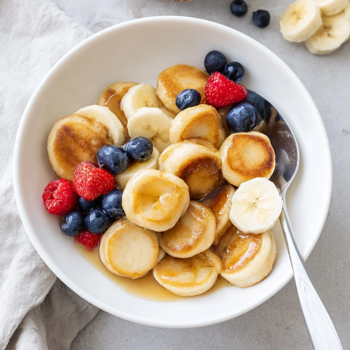 Adorable bite-sized pancakes, crispy outside and fluffy inside, perfect in milk.  