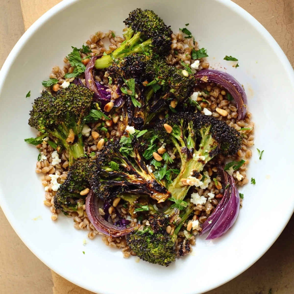 Golden roasted broccoli with garlic-lemon dressing served over a bed of farro, delicious.