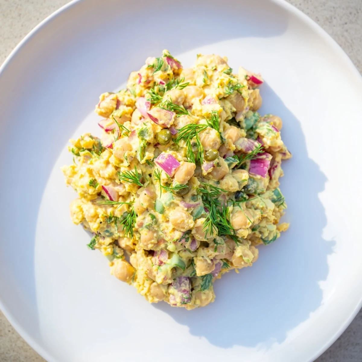 Creamy chickpea tuna salad, a vegan delight with seaweed flakes and crunchy vegetables, ready to serve.
