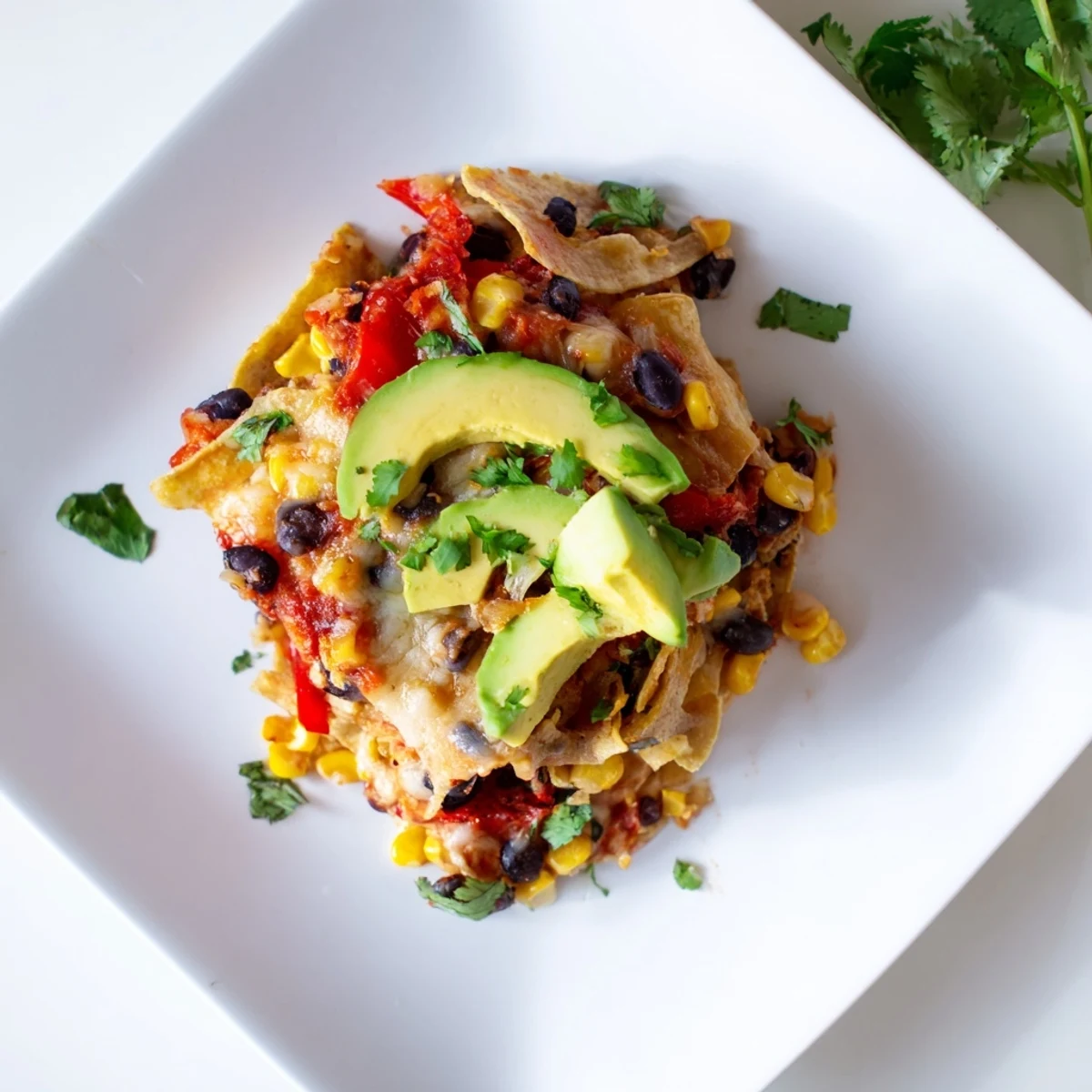 Layers of a delicious Quick Black Bean and Corn Tortilla Casserole, perfectly baked and full of flavor.