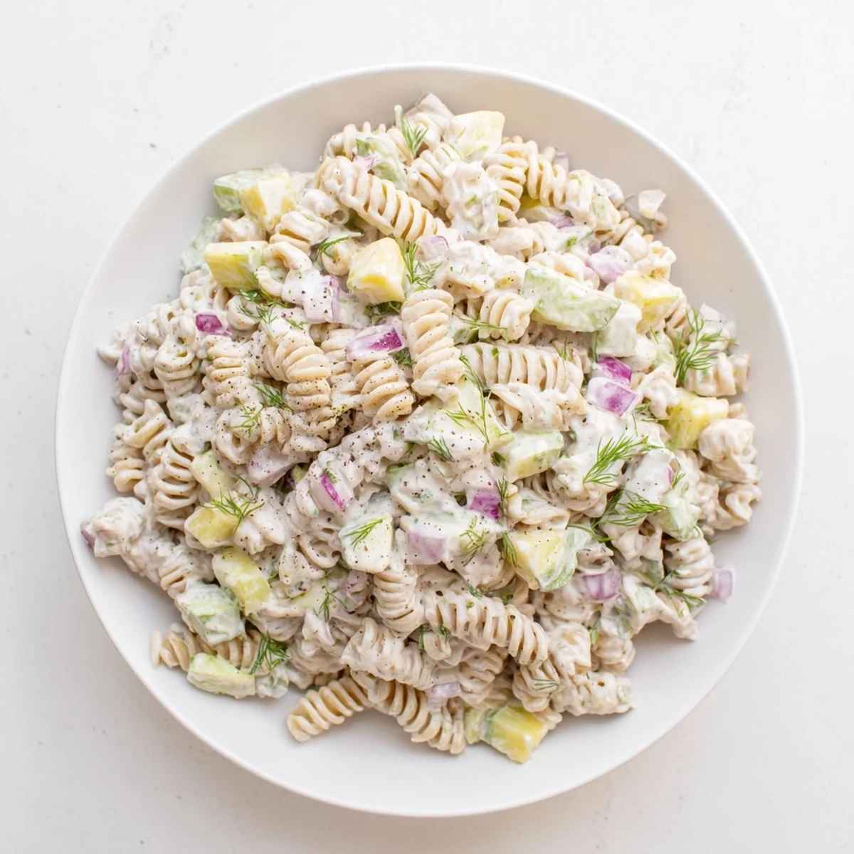 Chilled Dill Pickle Pasta Salad with tangy dressing, perfect for a summer picnic or potluck.