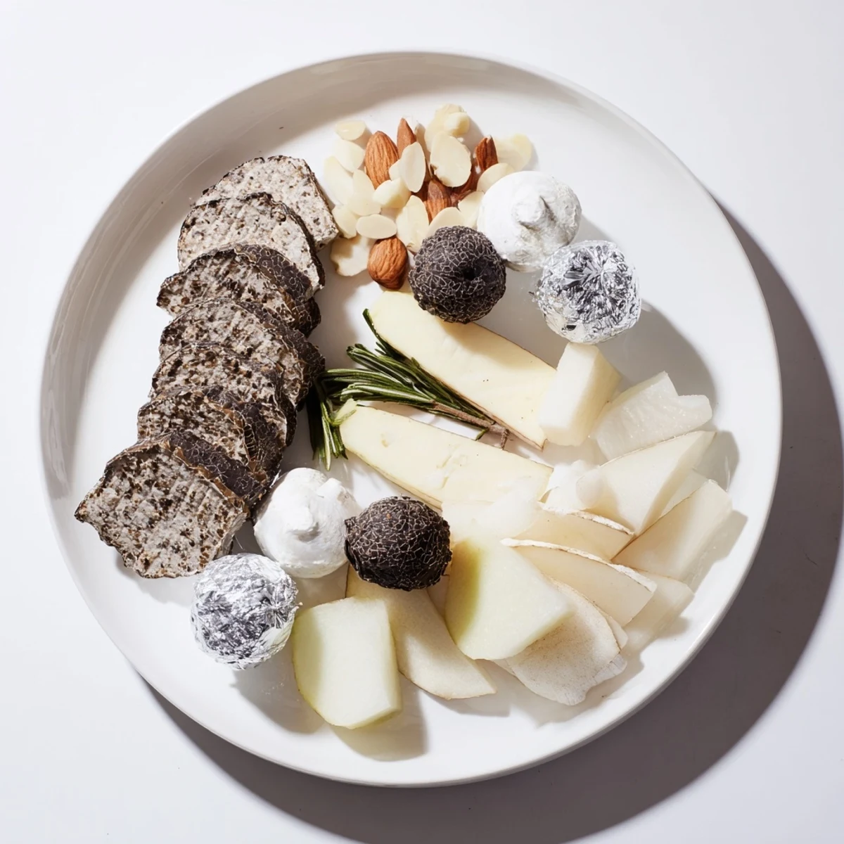 Elegant Silver Screen cheese board, featuring truffle brie, silver chocolates, and creamy goat cheese.