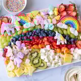 A close-up of a colorful, delightful Magical Unicorn Rainbow Dessert Board ready for a joyful party.
