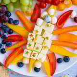 A visually exciting Blast Off Spaceship Snack Board featuring grapes, carrots, and mozzarella, ready to be enjoyed.