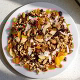 A snowy close-up of Snowflake Winter Blend, showcasing the colorful fruits and crunchy nuts.