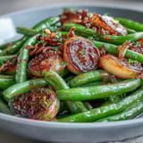 Tender green beans roasted to perfection with caramelized garlic, finished with bright lemon zest for a fresh, vibrant flavor.  