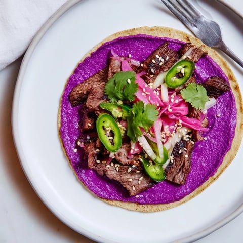 Colorful Global Street-Food Fusion Tacos filled with vibrant toppings and savory fillings.