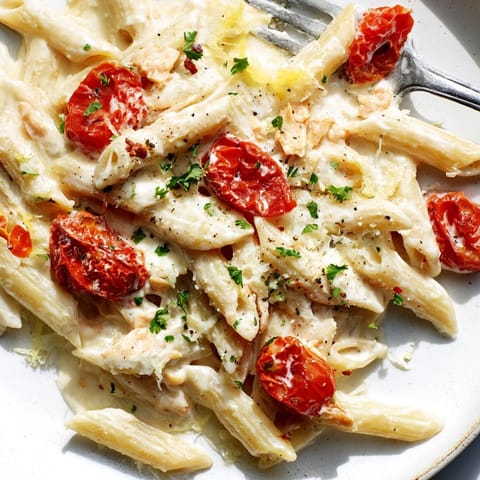 Creamy, herby Boursin Cheese Pasta with roasted tomatoes, ready to be plated and enjoyed.