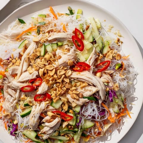 This flavorful Vietnamese Crunch Noodle Salad features tender chicken, crispy vegetables, and a zesty dressing.