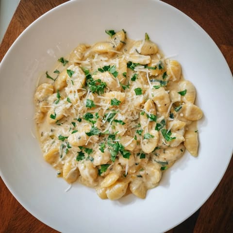 Enjoy a steaming plate of One-Pot Creamy Zucchini Ditalini, filled with vibrant zucchini and Parmesan cheese.