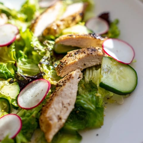 Sunlight highlights the juicy avocado and peppery radish slices in this refreshing, zesty Spring Detox Chicken Salad.