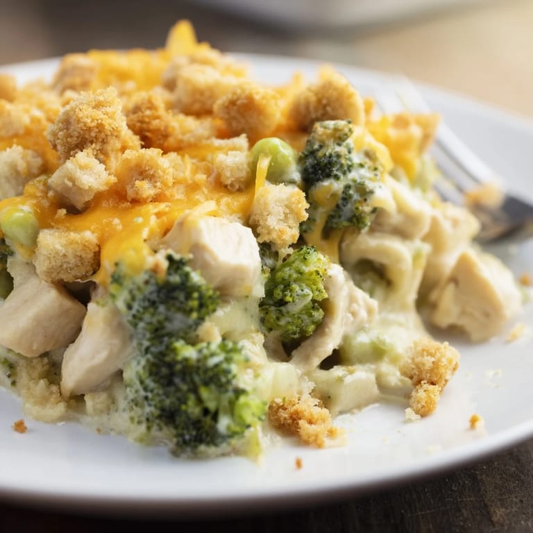 Golden-brown Chicken & Broccoli Cheddar Bake, perfect for cozy family dinners or potlucks.  