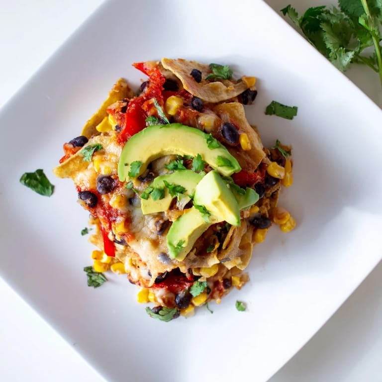 Layers of a delicious Quick Black Bean and Corn Tortilla Casserole, perfectly baked and full of flavor.