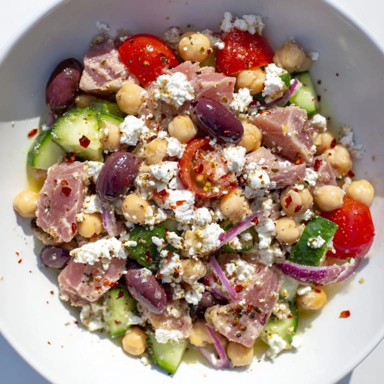 This healthy Tuna Chickpea Salad is a delicious combination of protein and veggies, perfect for lunch.