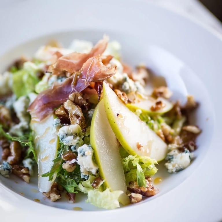 Elegant Frisée Pear Blue Cheese Salad, ready to be enjoyed with family.