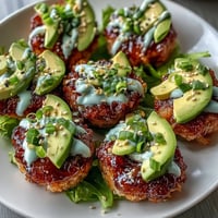 Spicy Tuna Crispy Rice Bites photo showing golden squares with vibrant toppings.